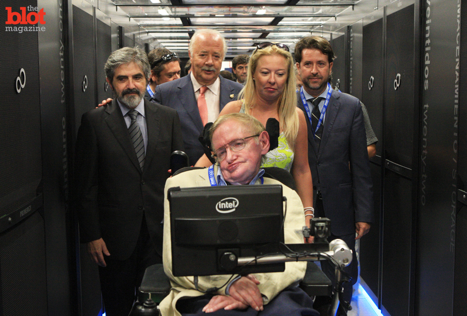 You may know his name, but you likely don't know a thing about the work of Stephen Hawking, seen here visiting a supercomputer in Spain with his staff, so we're here to tell you why he's the Belle of the Brainiac Ball. (© Splash News/Corbis)