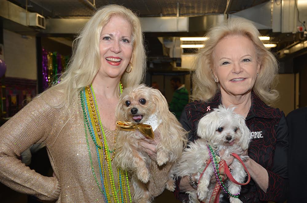 Rockette Leslie Riddle with her dog Puccini and Playboy Bunny Jane Pontarelli holding her Lulu.