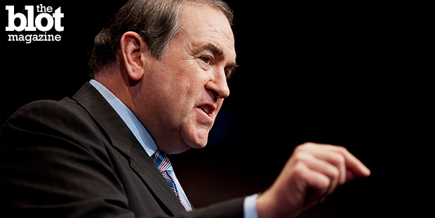 On tour for 'God, Guns, Grits and Gravy,' Mike Huckabee began to show his faux-populist, in-your-face evangelicalism and tinge of racism true colors. (© Pete Marovich/Corbis photo)